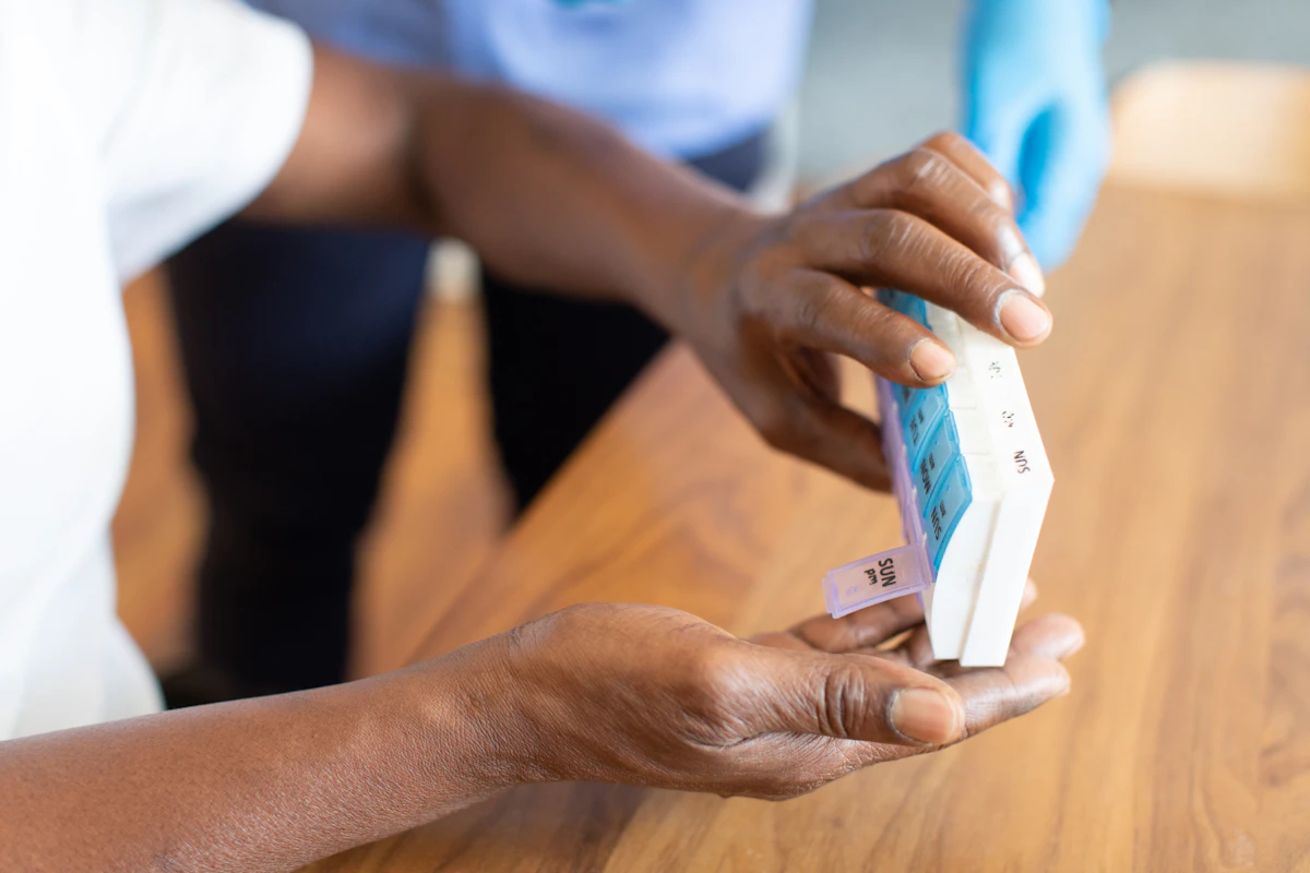A patient holding an insurance card during a healthcare visit.