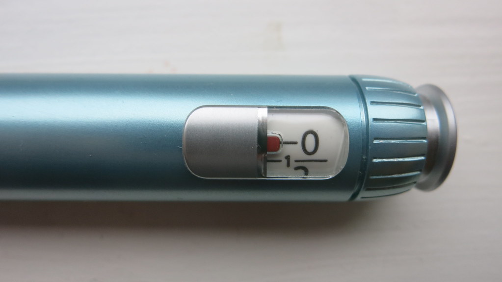 A close-up photo of an insulin pen dose window.
